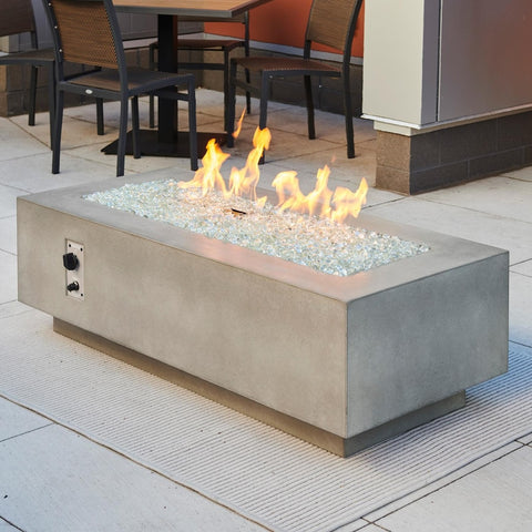 Cove 54 Inch Rectangular GFRC Concrete Propane Fire Pit Table in Natural Gray By The Outdoor GreatRoom Company